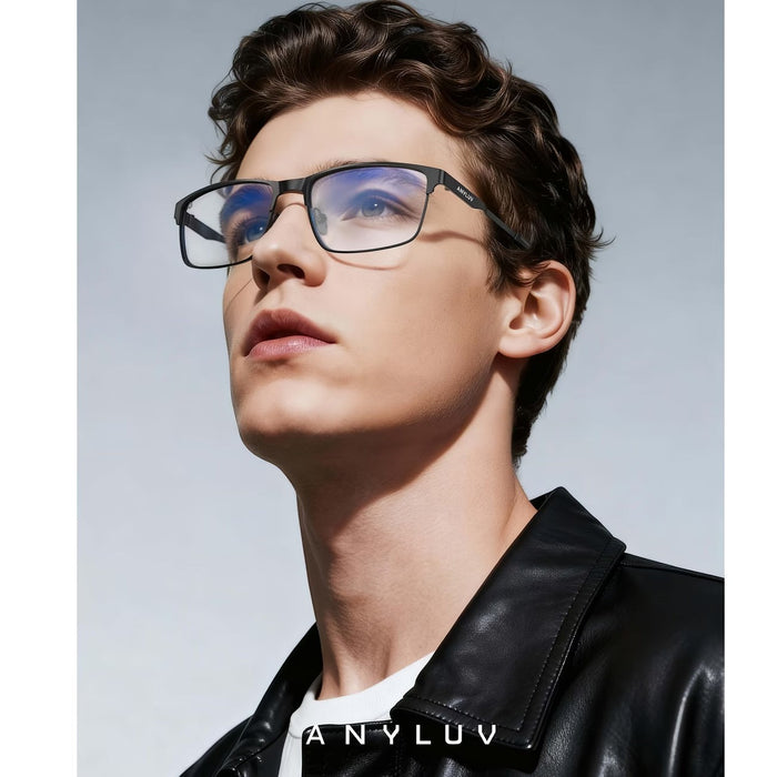 Blessing's blue light blocking glasses with black metal frames and clear lenses, worn by a male model.