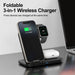 Blessing Foldable 3-in-1 wireless charging station in black, charging a smartphone, smartwatch, and earbuds.