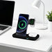 Blessing Sells 3-in-1 black wireless charging stand with iPhone, Apple Watch, and earbuds charging.