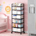 Blessing Sells black 6-layer wheeled storage cart filled with baby essentials like diapers, wipes, bottles, and toys in a nursery.