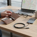 Blessing Sells Anker braided USB-C to Lightning cable, 6ft, black, charging an iPhone on a wooden desk.