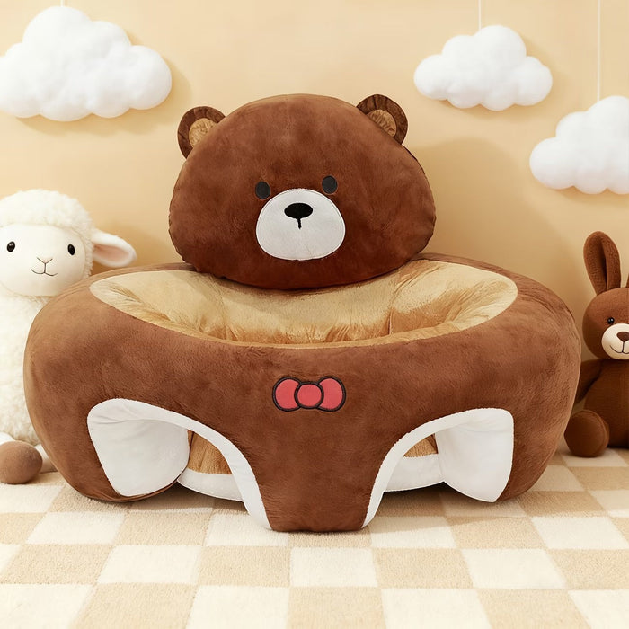 Blessing Sells brown plush toddler seat shaped like a bear with a red bow, offering back support for infants learning to sit.