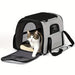 Blessing Sells grey and black ventilated cat carrier with mesh windows and a plush interior. A tabby cat is emerging from the carrier.