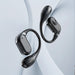 Blessing Sells dark grey true wireless over-ear headphones with a sleek, modern design and ear hook.