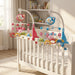 Blessing Sells musical crib mobile with projector, featuring animal characters in pink and blue, plays gentle melodies and projects stars.