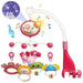 Blessing Sells musical crib mobile with projector, featuring animal characters, stars, and music notes. Pink and white.