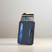 Blessing Sells navy blue faux leather card case with metal trim, holding multiple credit cards.