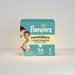 Blessing Sells Pampers Swaddlers Size 1 diapers, 96 count, featuring a mother holding her baby. Designed for best dryness and comfort.
